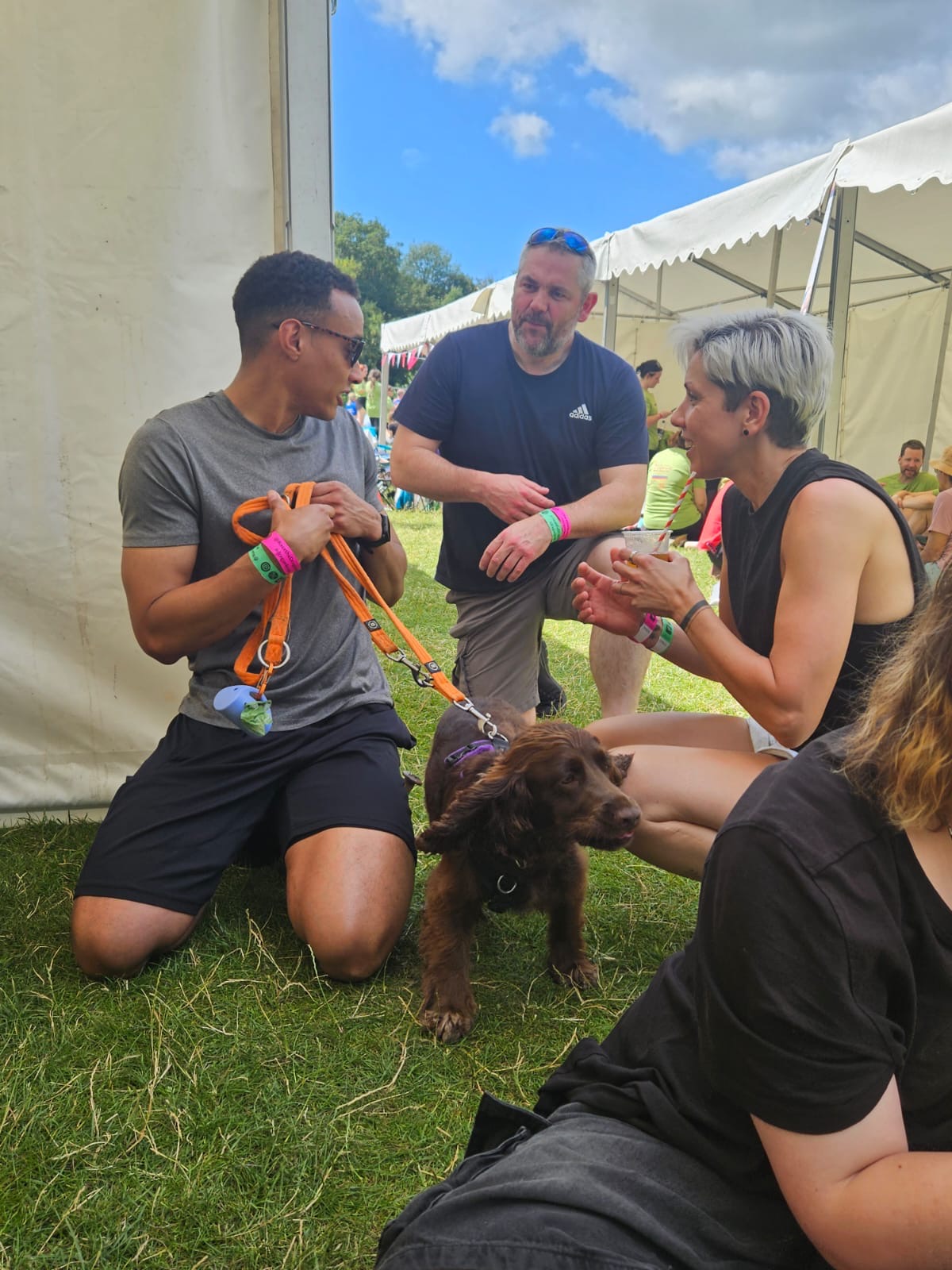 Epta team socialising with a dog