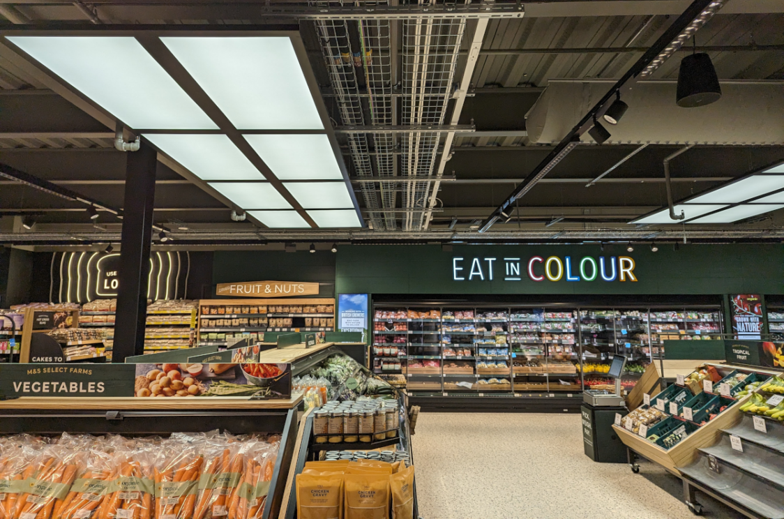 Interior of the M&S Washington food hall with vibrant signage reading 'Eat in Colour,' emphasising fresh and colourful produce displays
